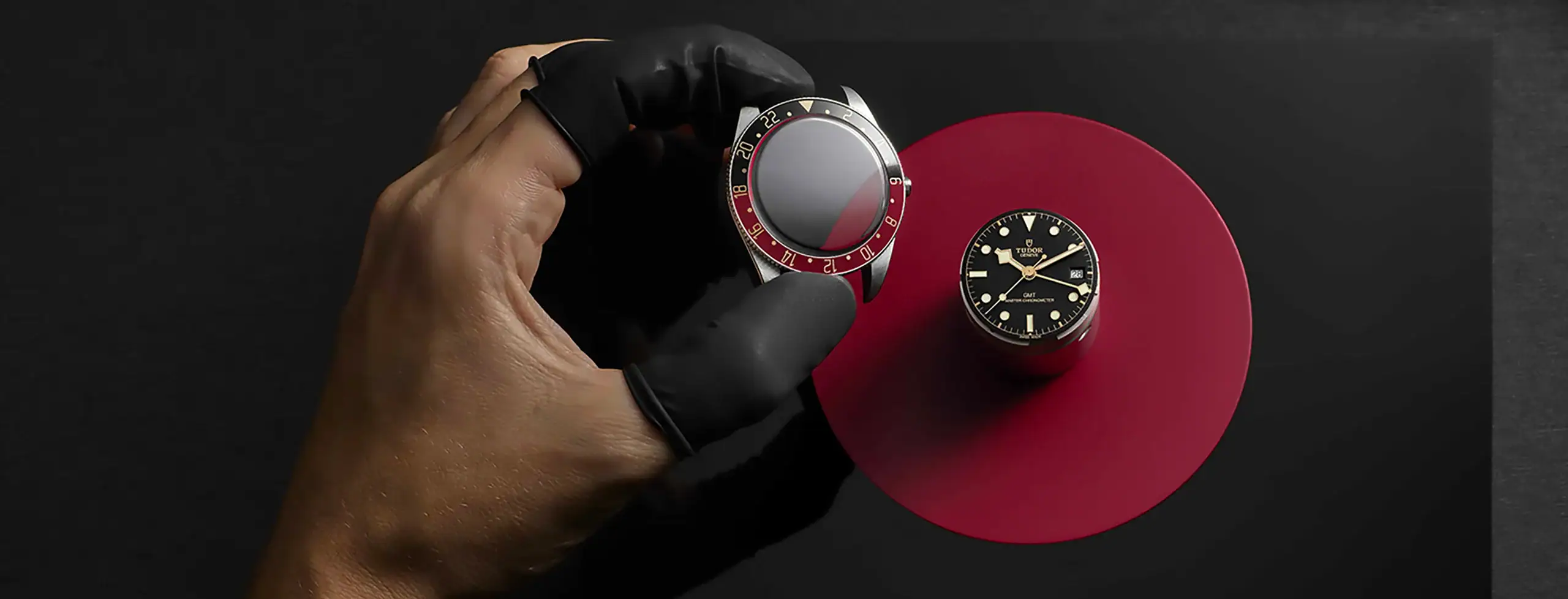 The World of TUDOR 2560 x 978 Tudor watch case and red bezel being assembled - Washington Watches